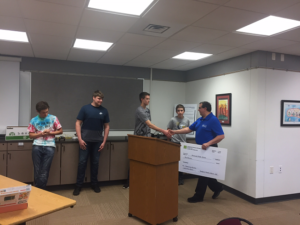 Andy Tabisz of WorkSmart Database Masters shakes hands with Hudsonville programming students